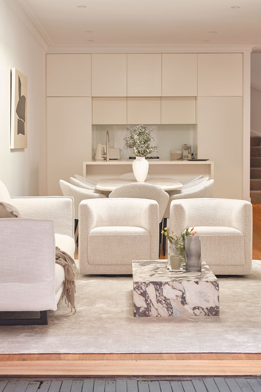 Neutral living room with cream sofas designed by graduate Carolina Ghigonetto