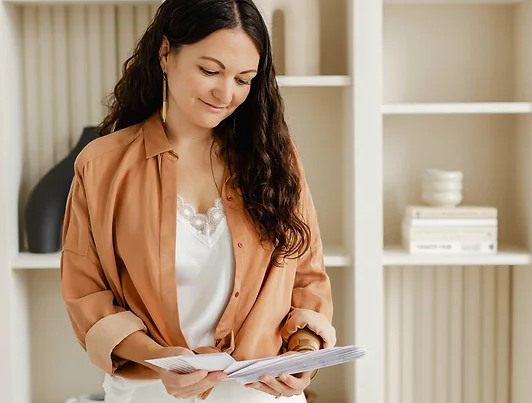 Interior designer Agathe Corbet reading a sample book