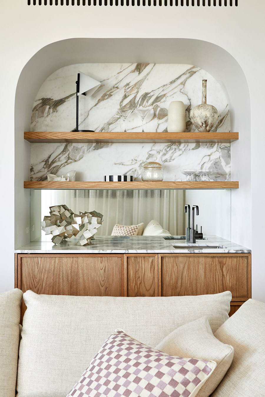 Bronte home with an arched marble shelf niche and daybed, Jillian Dinkel Designs