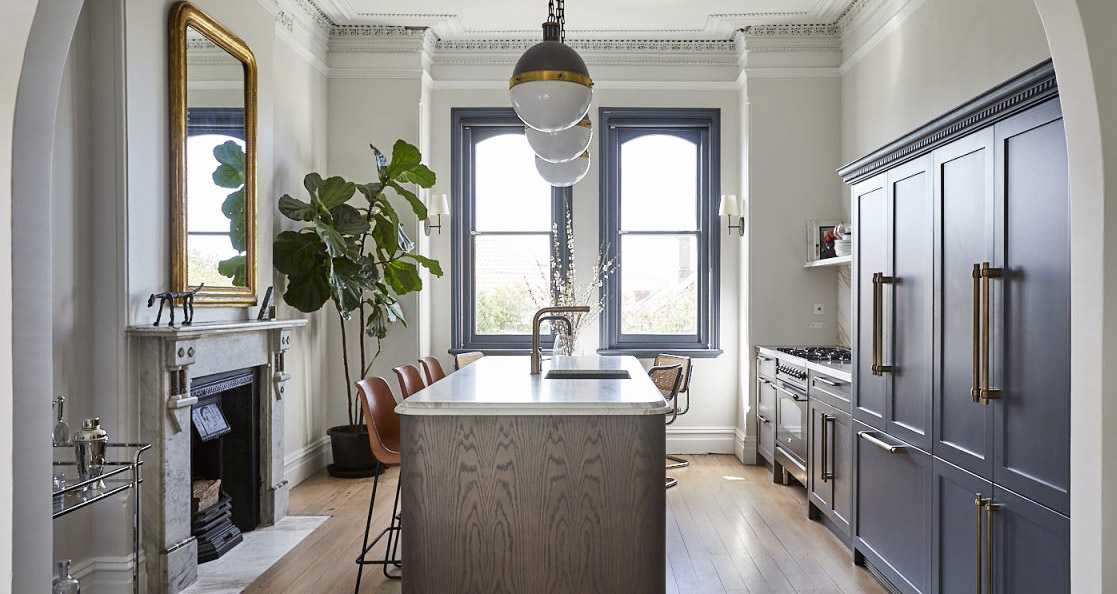 Quinton Road kitchen with a marble island and dark cabinetry by Jillian Dinkel Designs