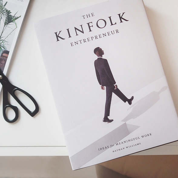 The Kinfolk Entrepreneur book beside scissors