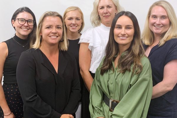 Group of Sydney Design School graduates smiling together