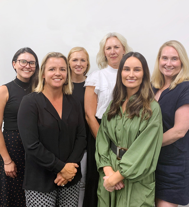 Group of Sydney Design School graduates smiling together