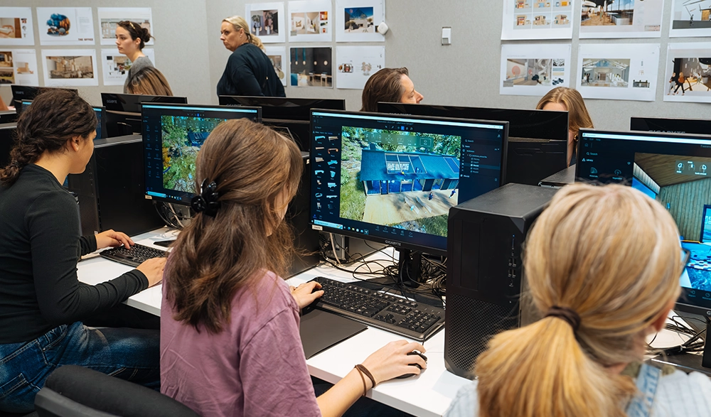 Open day visitors exploring the computer lab at Sydney Design School