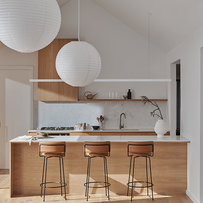 Illawong kitchen with timber island and paper pendant lights by Rebecca Leijer