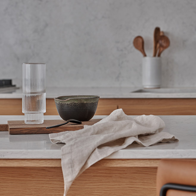 Illawong kitchen bench styling with stone vessels by Rebecca Leijer
