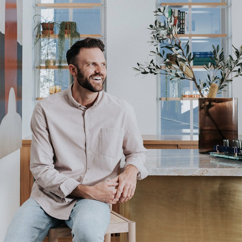 Ryan McGregor, Sydney Design School graduate, seated portrait