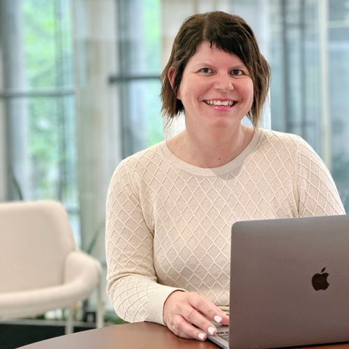 Wendy Beard, Sydney Design School team member, working on a laptop