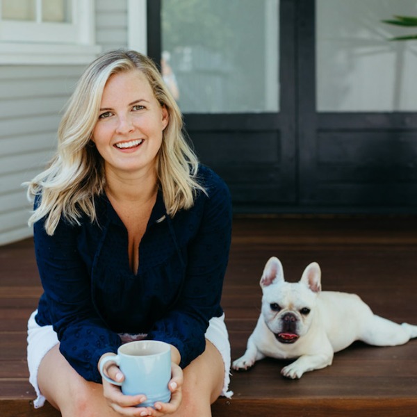 Coco Tully, founder of Cote Interiors, with her French bulldog